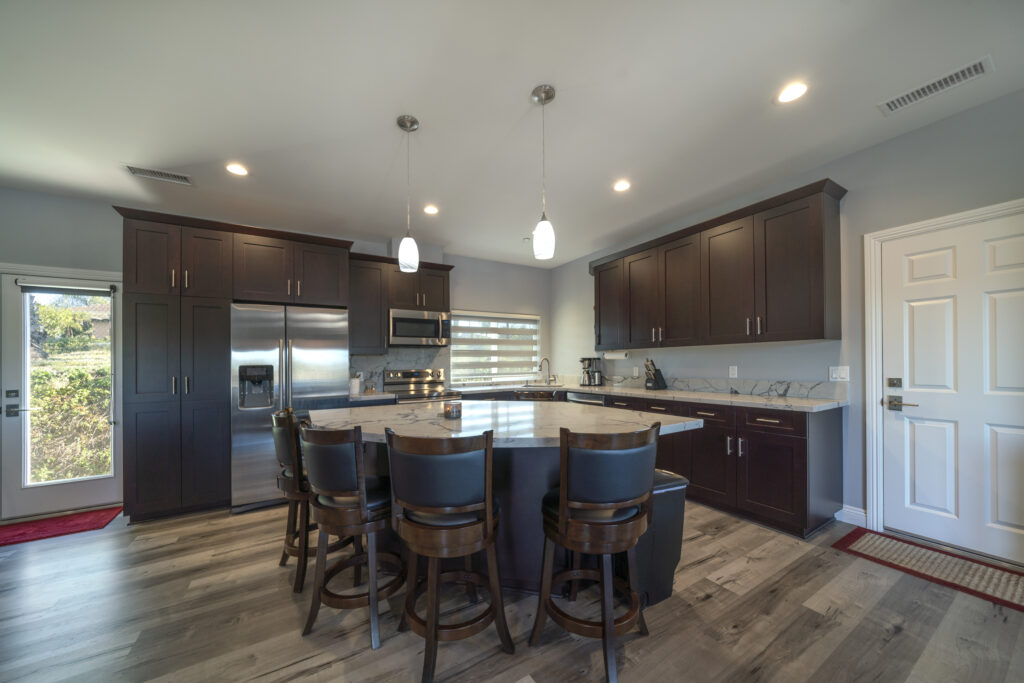 This unique kitchen island in a custom Accessory Dwelling Unit has plenty of room for food preparation, serving, or just enjoying a morning cup of coffee with a friend.