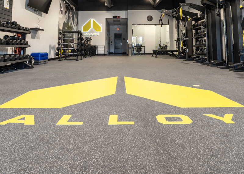 The Alloy Gym floor decal in a commercial remodel project by Youngren Construction in Encinitas