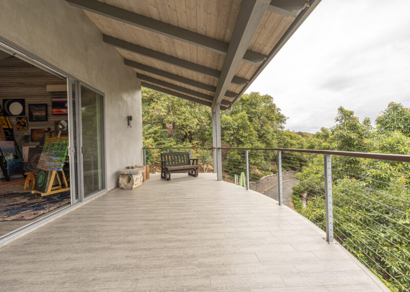 Large covered patio outside a home art studio created by Youngren Construction
