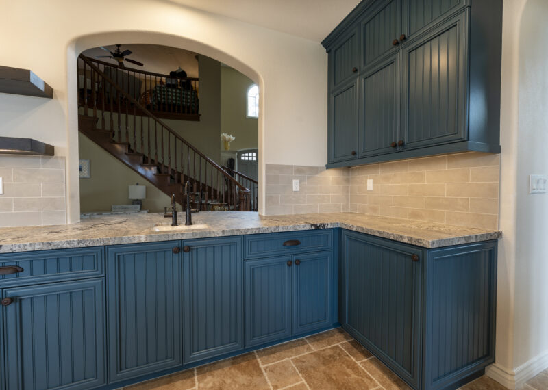 Custom blue cabinets in kitchen remodel by Youngren Construction