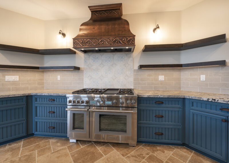 Double oven and custom hood vent in kitchen remodel