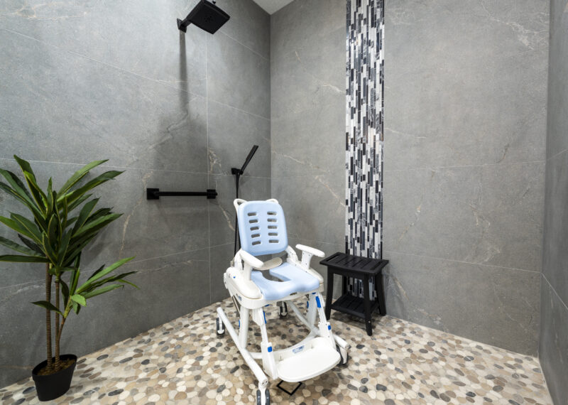 Shower chair used in an ADA accessible roll in shower by Youngren Construction