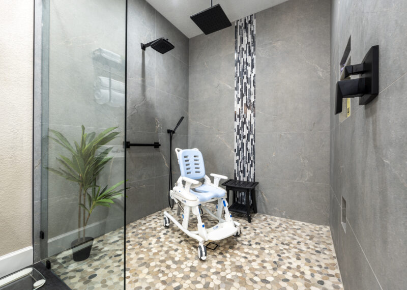 Shower chair used in an ADA roll in shower by Youngren Construction