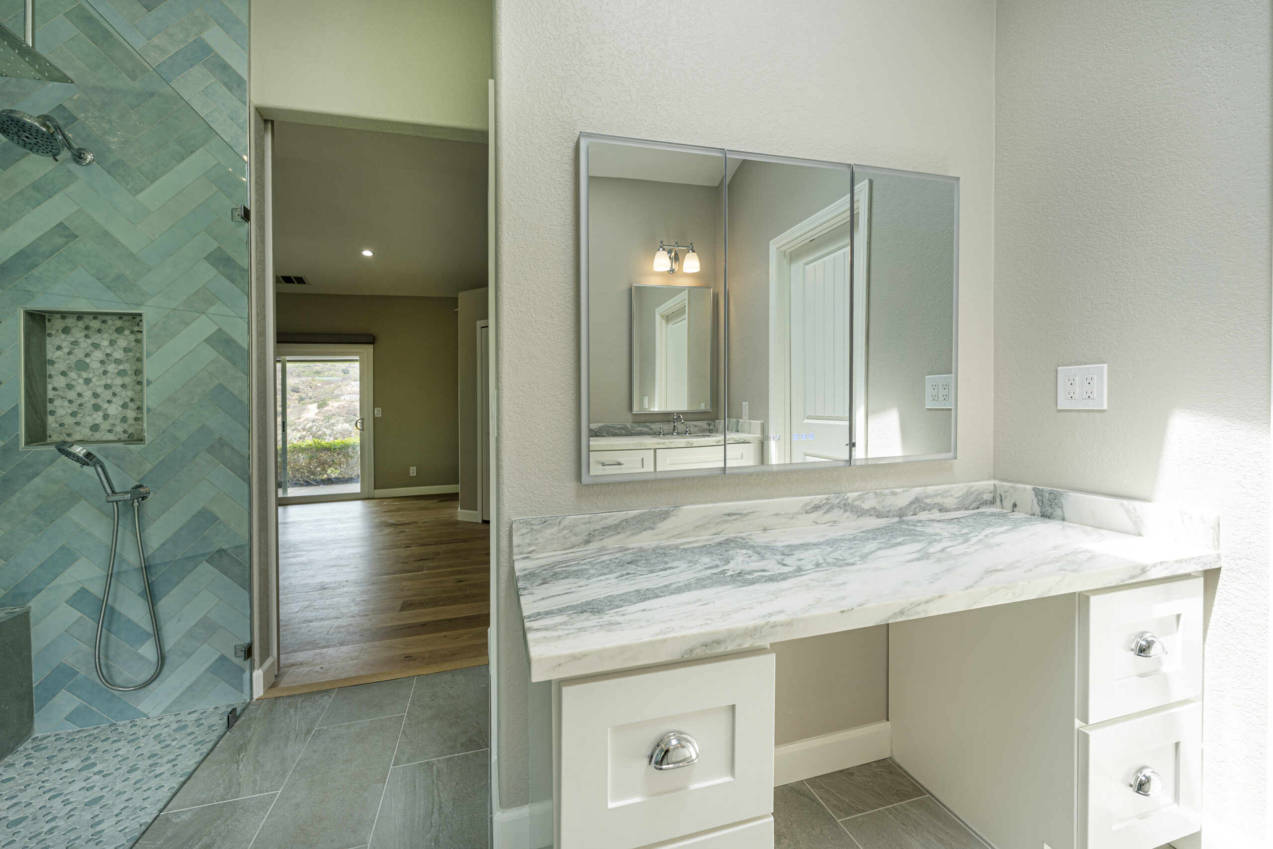 Stylish, convenient makeup counter with custom vanity.