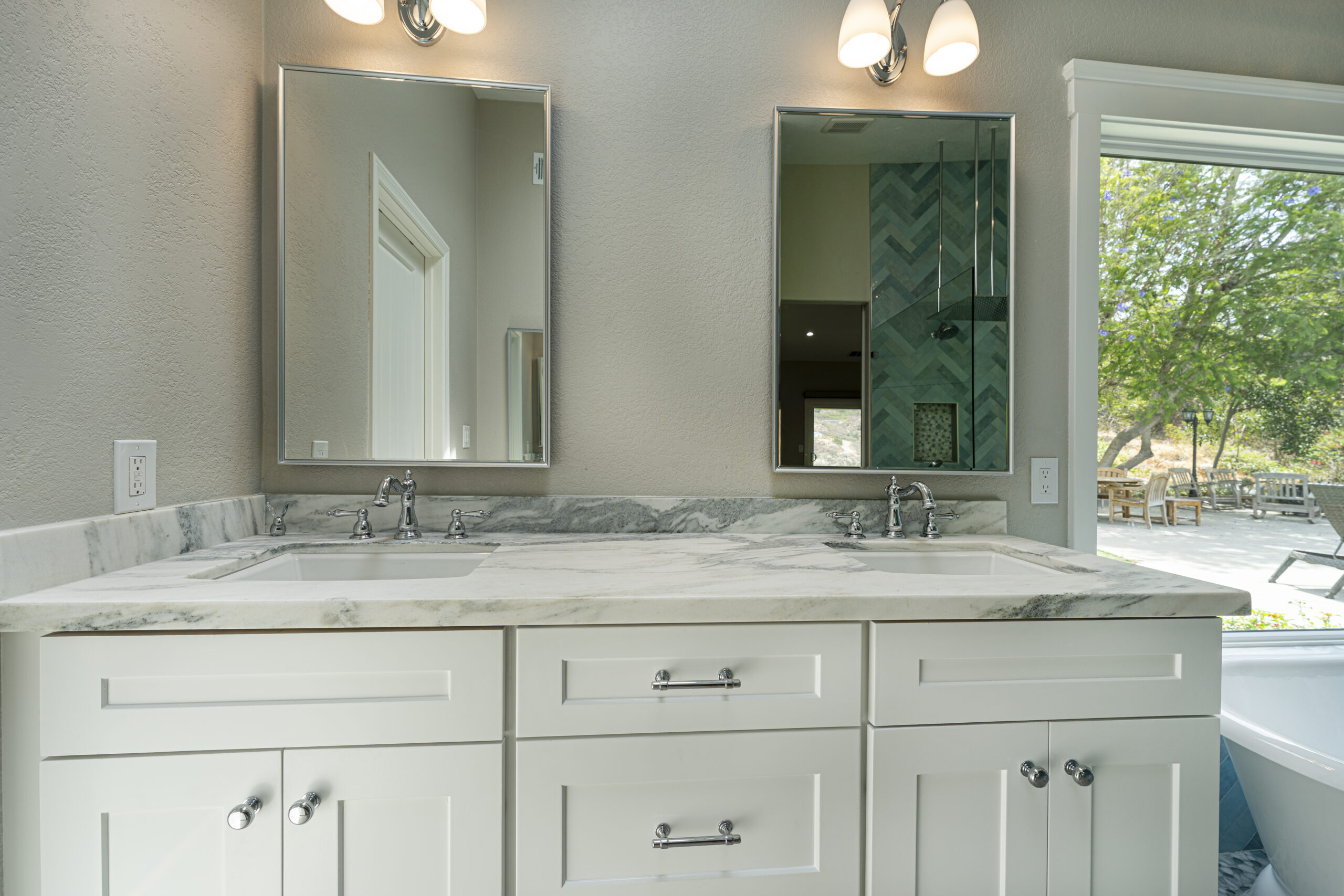 Double sinks and double mirrors in this master bathroom vanity.