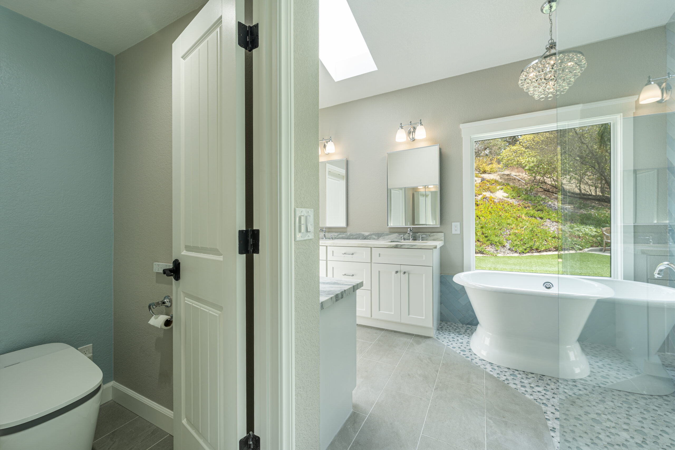 Step into this master bathroom remodel with a bright, luxurious aesthetic.