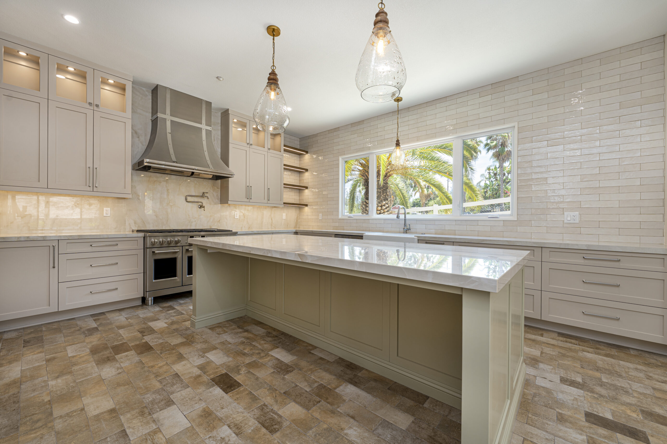 Large, custom kitchen island with space for barstool seating.